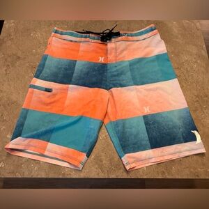 New never worn Hurley Blue and Orange Board Shorts. Size 34